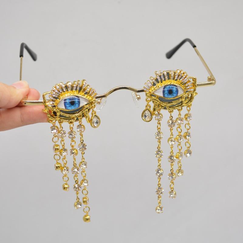 Rhinestone eyeball details on gothic sunglasses
