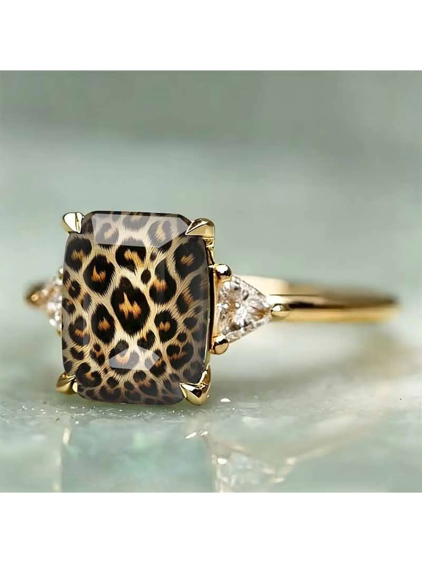 Retro leopard print square pattern main stone ring. Side triangular transparent accents for a luxurious finger ring. Sweet and cool personalized women's daily wear trendy decorative accessory.