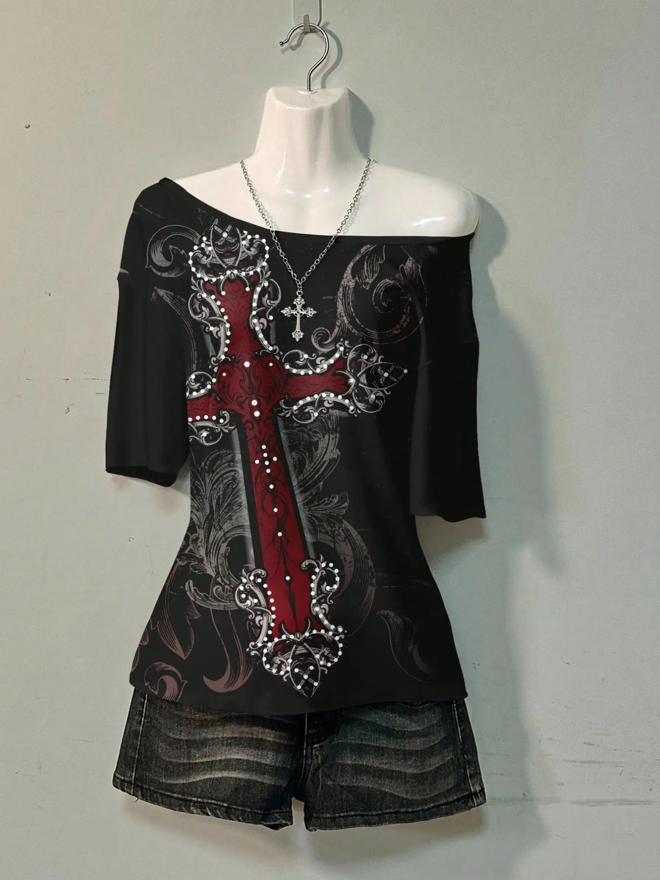 Women's off-shoulder drop-short sleeve T-shirt for autumn, featuring vintage cross print with hot-fix rhinestone embellishments. The loose fit conceals body flaws and creates a slimmer look, a street-style distinctive women's apparel Top. #WomenTshirt