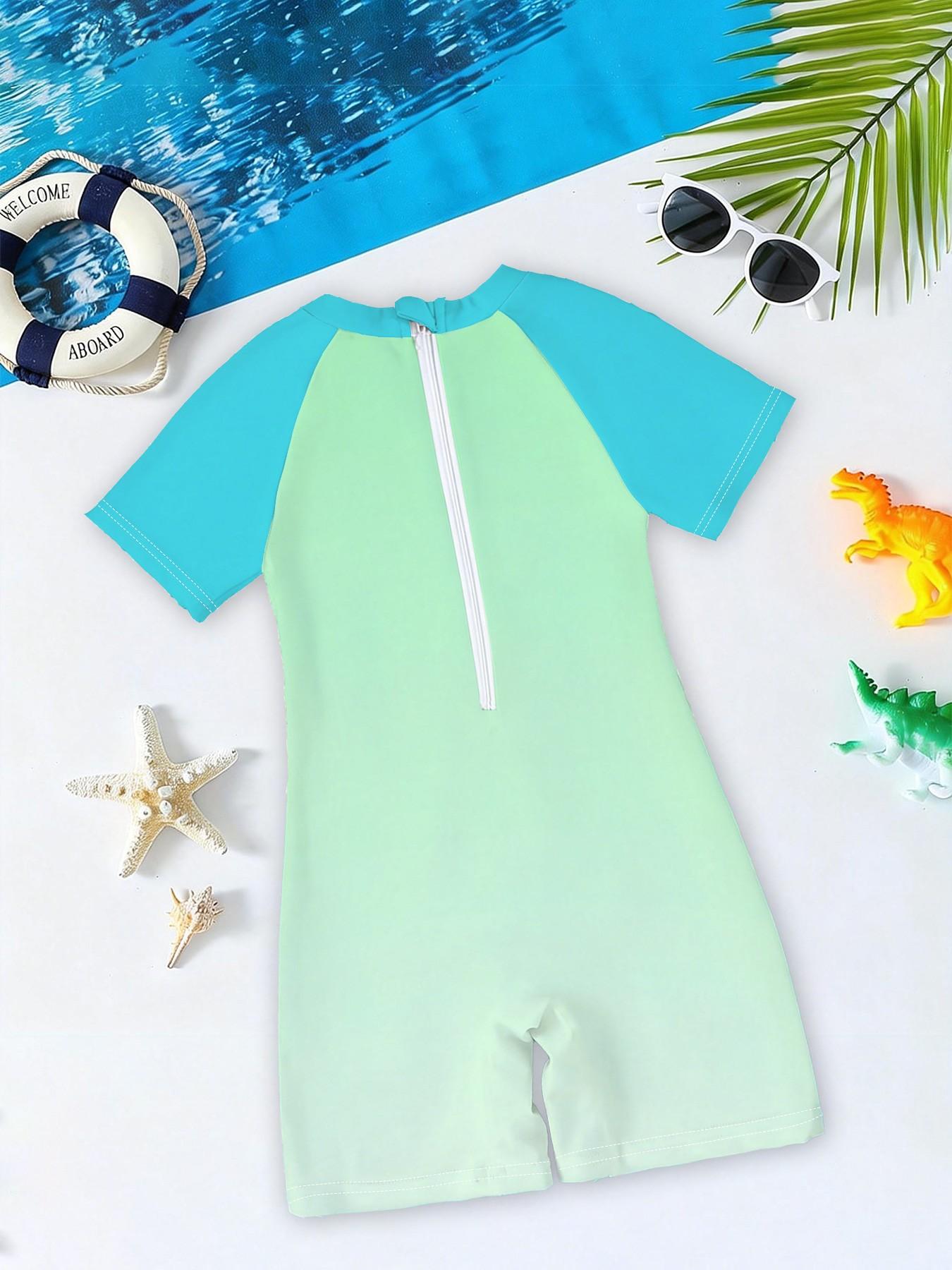 Boys' one-piece swimsuit "Ninja Turtles Breakthrough Screen Edition" features full vintage Ninja Turtles breakthrough screen print and raglan lake-blue sleeves. It is trendy, cool and sun-protective, eye-catching for summer water play and beach vacations.