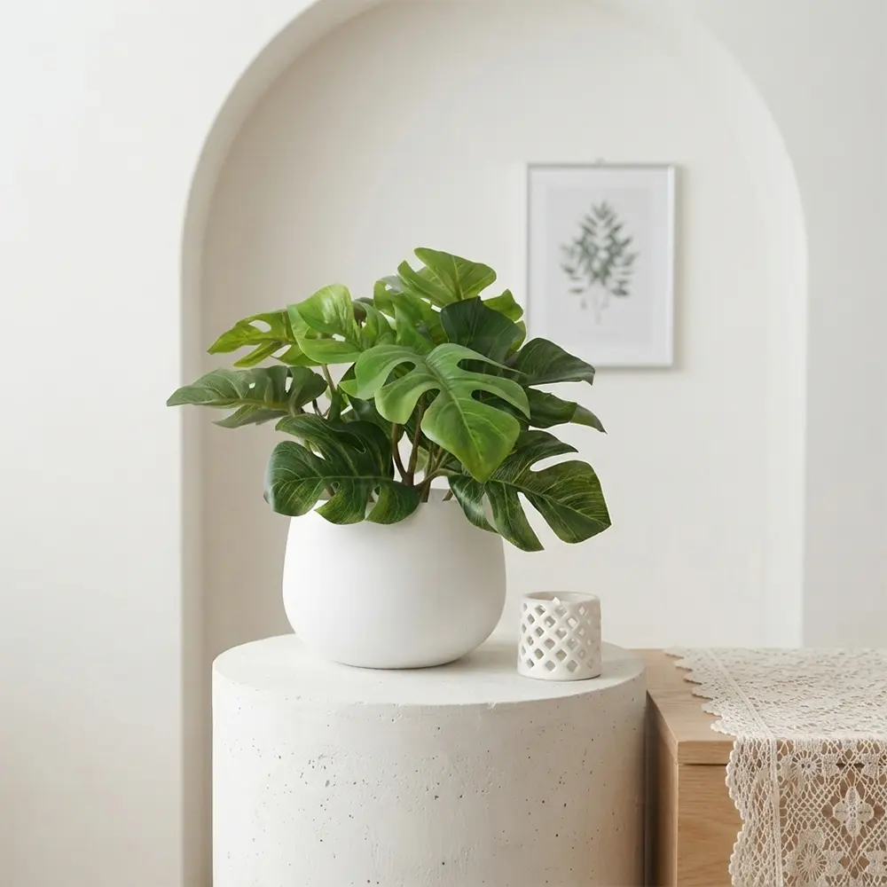 1/2 pcs. Minimalist artificial Monstera plant in a pot, perfect for indoor settings such as living rooms, home offices, entryways, cafes, and clothing stores—a decorative tabletop plant that adds plenty of ambiance.