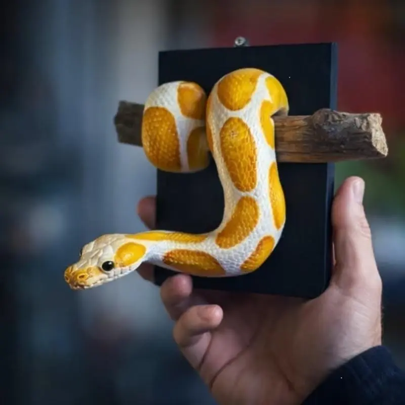 The new and interesting golden ball python wall sculpture, an art decoration pendant inspired by nature for home decor, is an ideal choice for Halloween and Christmas home decorations.