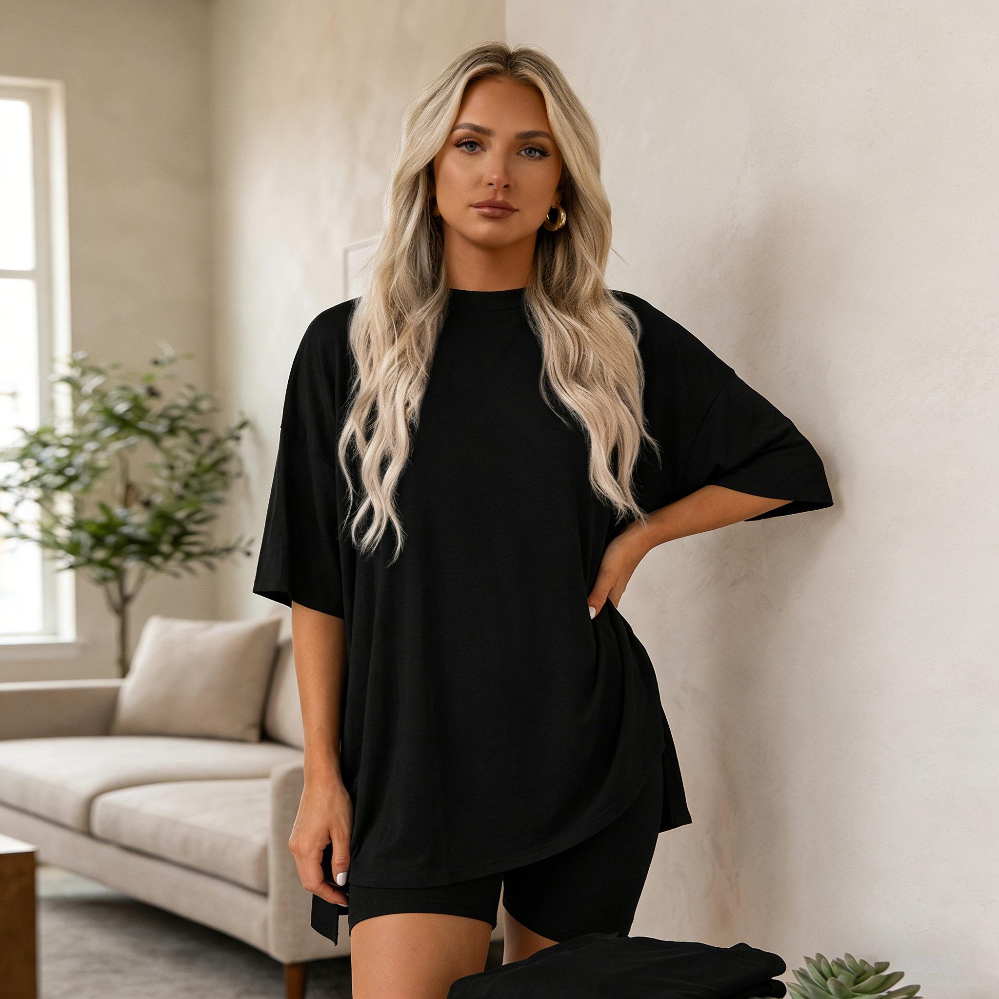 Women’s summer crewneck two-piece loungewear set, ideal for home relaxing. Features an oversized split-hem top and biker shorts with side pockets. Made of soft viscose, it’s lightweight and easy to care for.