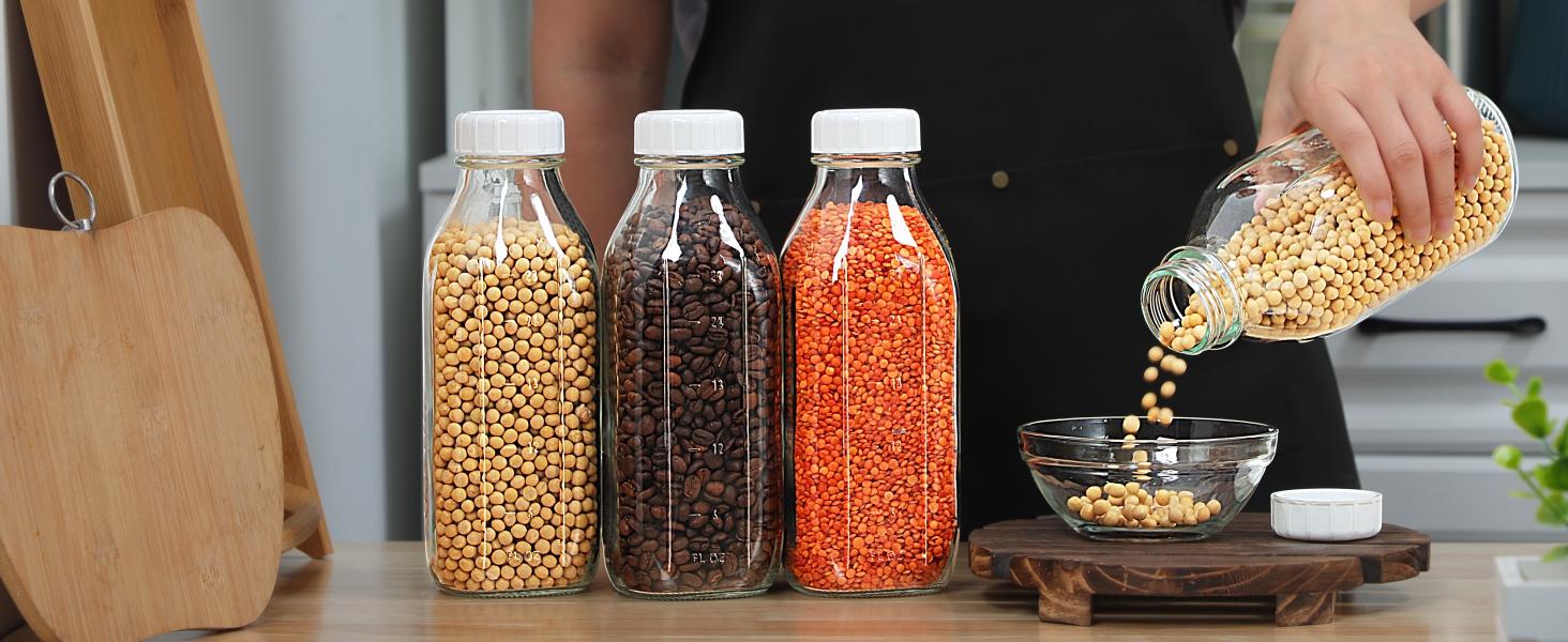 THE WELL KEPT 4 Pack 1 Liter (32 Oz) Glass Milk Bottles With Scale, 100% Airtight Heavy Duty Screw Lids, and 2 Pour Spouts-For Milk, Honey, Jam, Creamer-Dishwasher Safe (Extra 2 Lids Included) Silicone Beverage