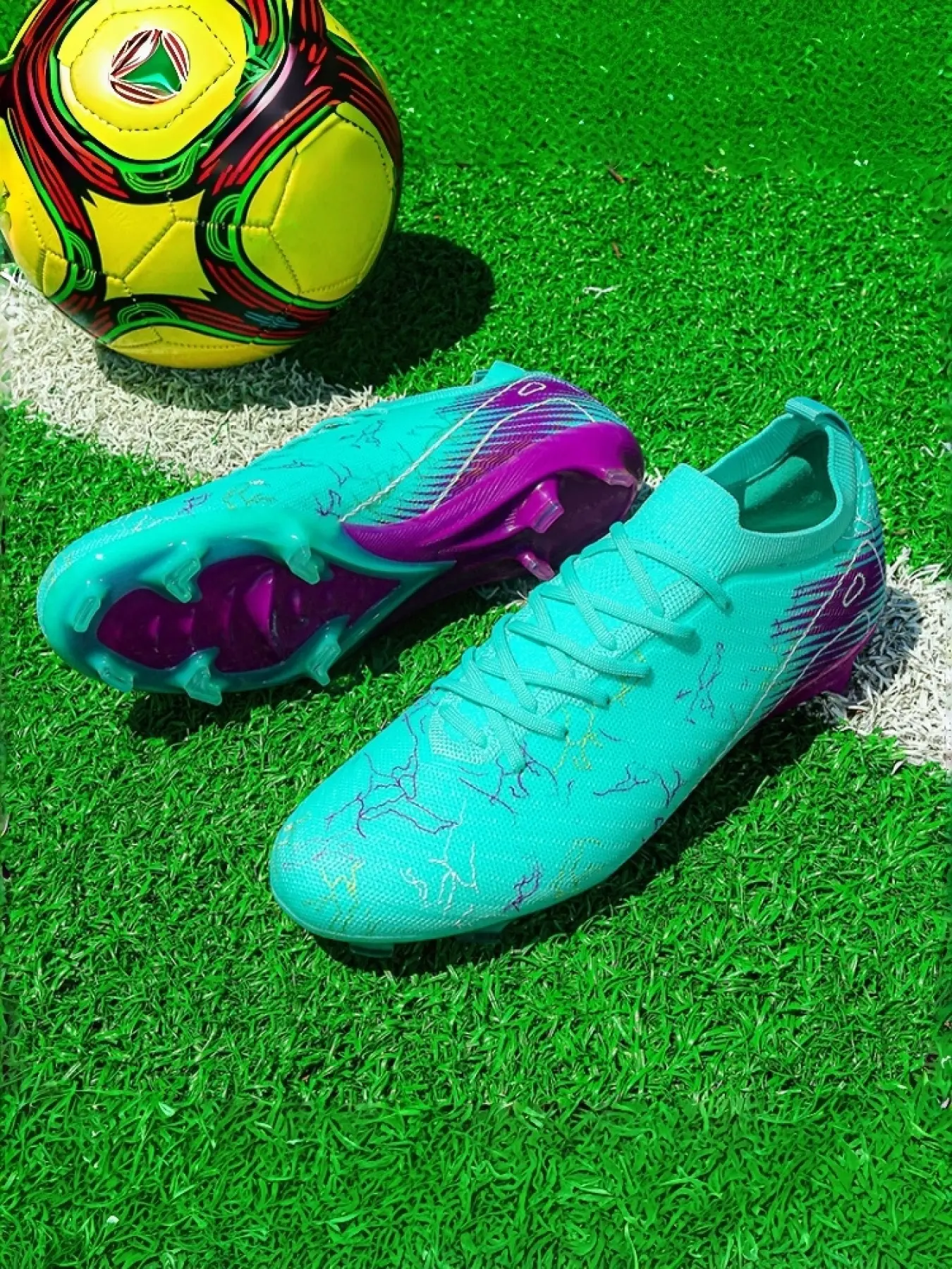 1 Pair Unisex White-Blue-Pink Gradient Studded Football Shoes. Lightning splatter print, breathable flyknit upper, anti-slip & wear-resistant TPU stud sole. Suitable for natural grass pitches, training and matches