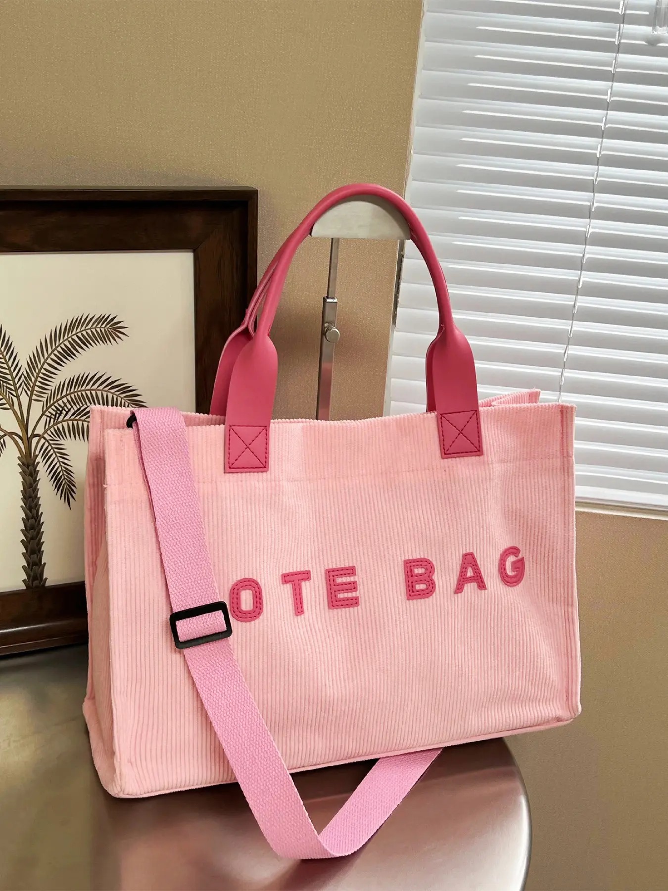 Simple and versatile large capacity letter design corduroy tote bag can be carried by hand, slung over one shoulder, suitable for daily commuting to work