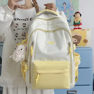 Fresh and sweet style, creamy yellow polka dot backpack with a youthful vibe, high aesthetic appeal, multi-compartment design for primary and secondary school students