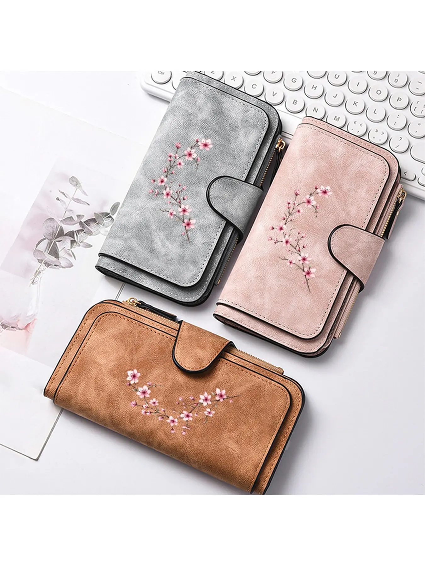 A ladies' wallet decorated with a pink plum blossom pattern, a long ladies' hand-held coin purse, suitable for multiple scenarios, and designed with multiple card slots to meet your daily storage needs. It is a birthday gift/Halloween gift/Christmas gift