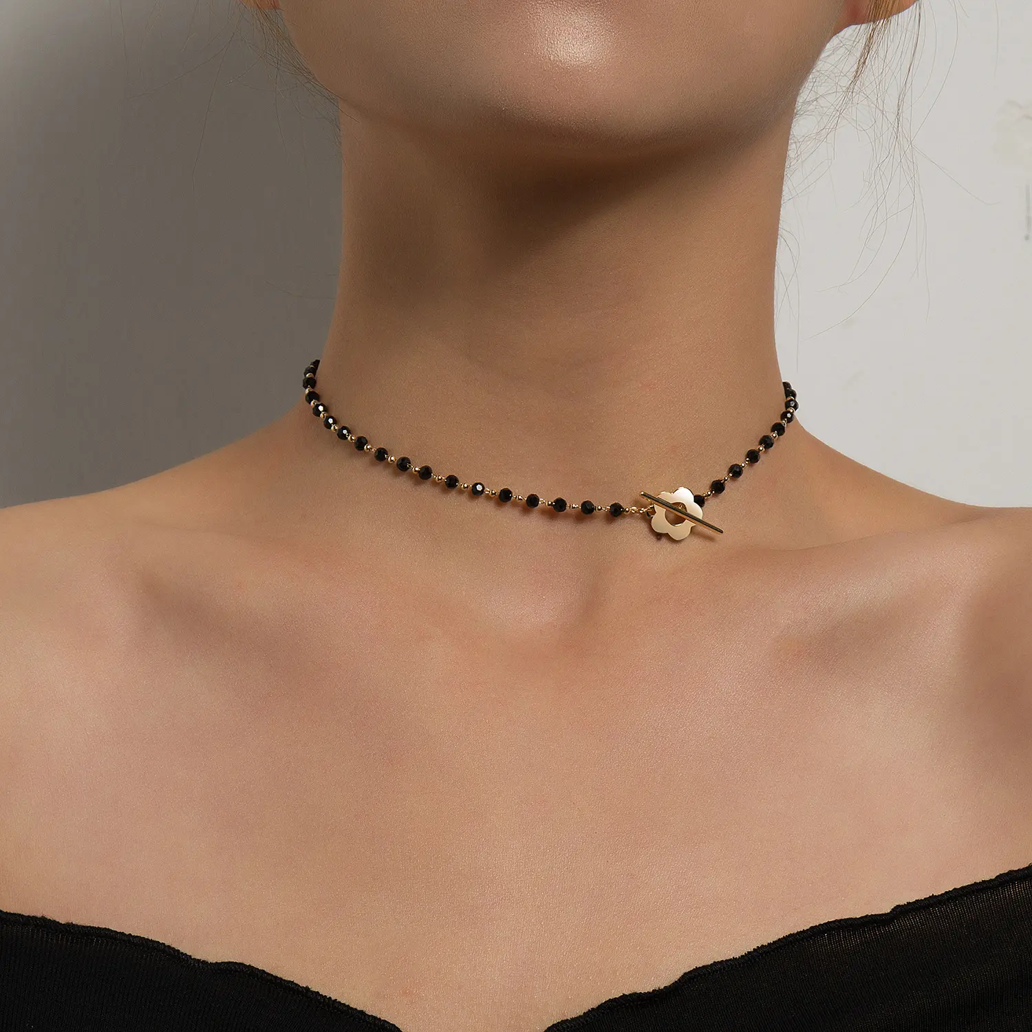 Dainty Choker Necklace for Women with Faceted Black Crystal Beads, Elegant Gold-Tone Hollow Flower and Toggle Clasp