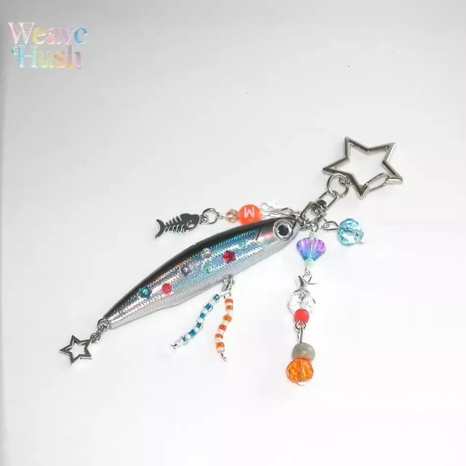 Funny creative small fish pendant keychain with built-in jingle bell, designed as lure fishing pencil shape. Cute decorative accessory that can be hung on keys, backpacks and fishing bags for fishing lovers.