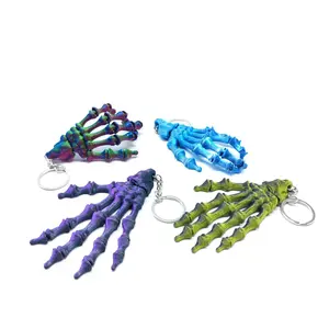 Halloween Skeleton Hand Keychain, Viral Gothic Bag Charm with Glow In The Dark 3D Printed Design, Flexible Articulated Joint Skull Hand Pendant, Colorful Horror Key Ring for Backpack, Car Keys, Spooky Party Gift Decor