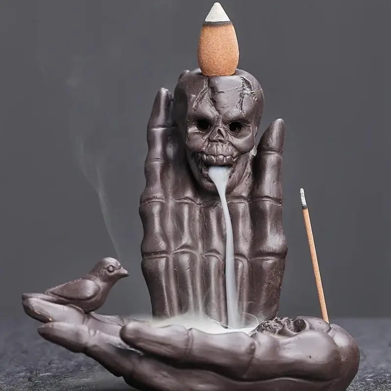 Backflow incense burner crafted from purple clay with ghost skull design. Its unique dark style suits Halloween, Christmas and other festivals. Great desktop decor with stunning vibe, a distinctive aromatherapy ornament for home.