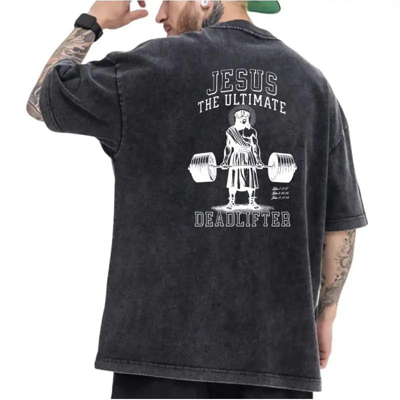 Washed Black T - shirt Featuring White "Jesus The Ultimate Deadlifter" Lettering and Lifting Illustration