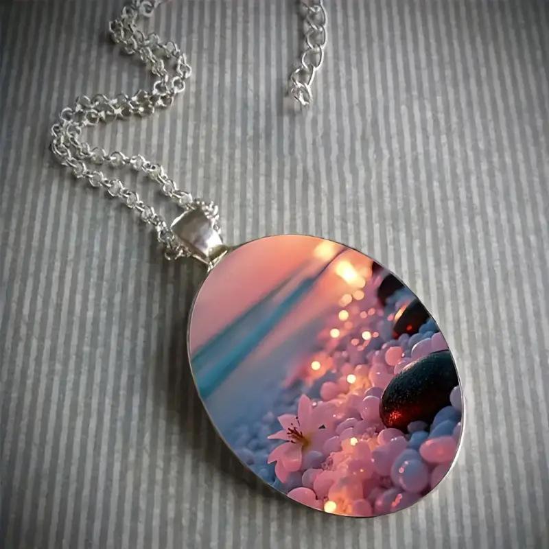 A beautiful summer beach ocean-themed oval-shaped silver alloy glass pendant and stainless steel chain