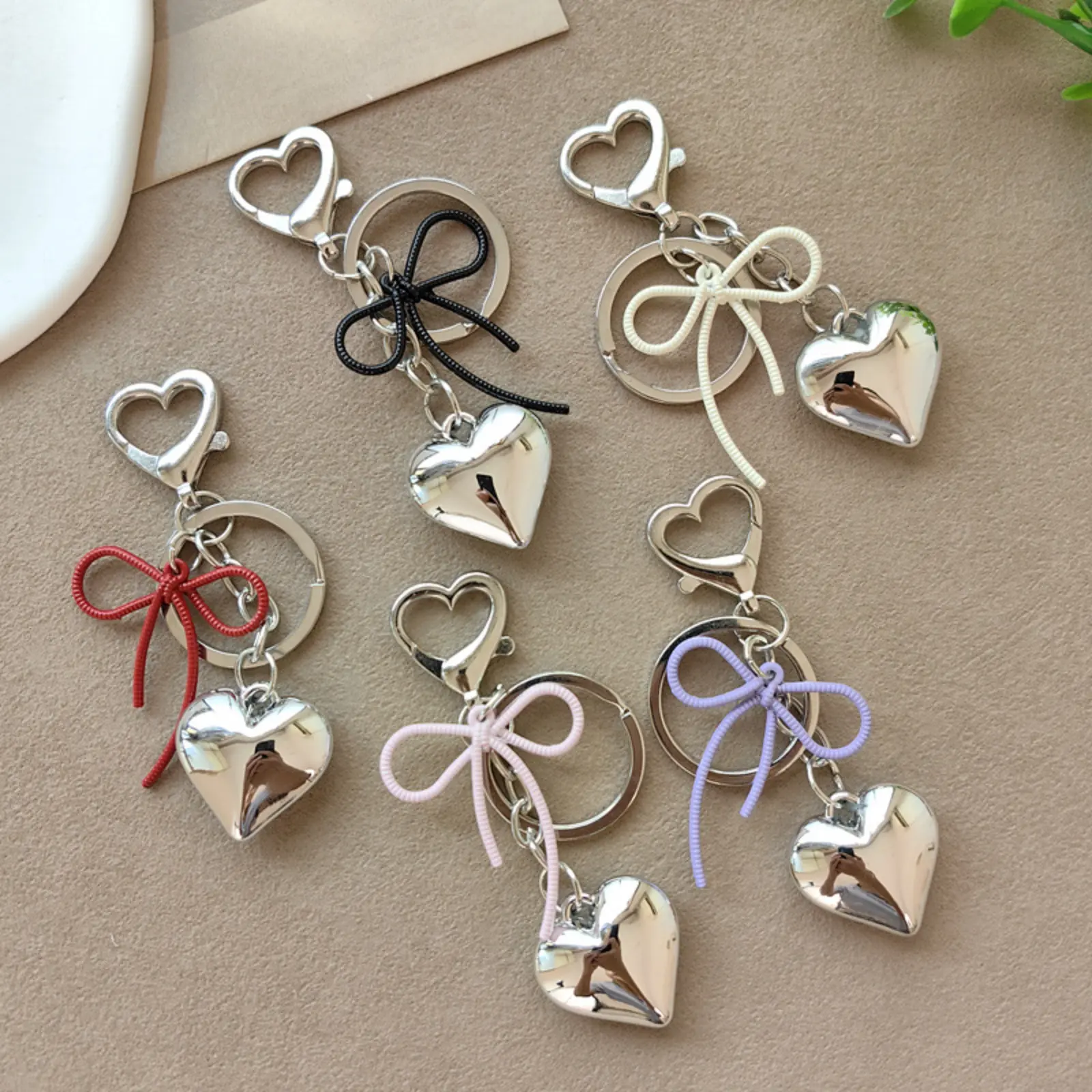 Minimalist Heart Alloy Keychain with Black Rope Bow Charm, Small Unisex Accessory for Everyday Wear on Backpacks & Earphone Cases