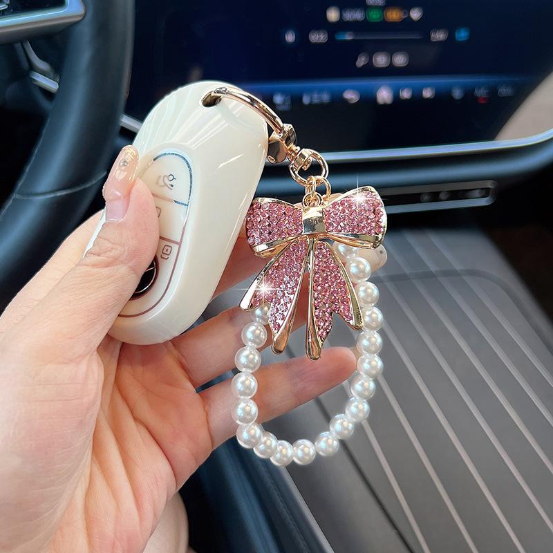 Rhinestone Bow Keychain with Pearl Wrist Strap, Luxury Bling Bow Car Key Ring, Elegant Metal Bag Charm Accessory for Women