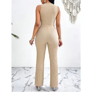 Textured suit pants set with fringed hem, asymmetrical vest, and straight-leg pants