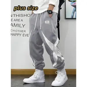 Trendy joggers designed for plus size men decorated with star and slogan prints, constructed from breathable fabric and equipped with drawstring ankle ties, offering a comfortable relaxed fit; ideal summer trousers for daily jogging and regular work commu
