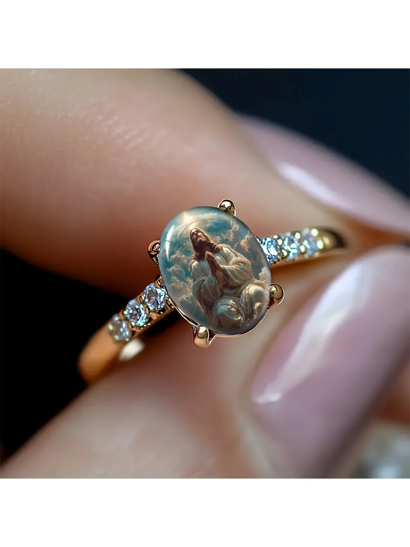 Prayer Ring with Hands in Prayer Position - Jesus in an Elliptical Setting with a Cloud-like Halo Over His Hands. The figure of Jesus, with exquisite and solemn clothing, is depicted with a solemn and sacred atmosphere. Transparent and glittering diamonds