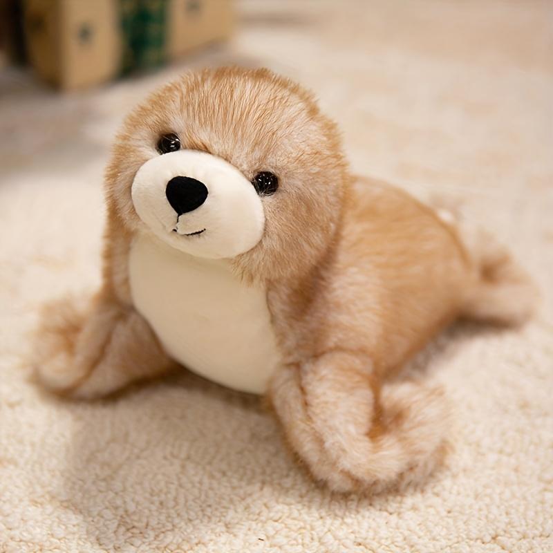 Adorable plush sea lion toy, super soft stuffed animal in a lazy pose, with silky fins suitable for cuddling and sensory play in the nursery