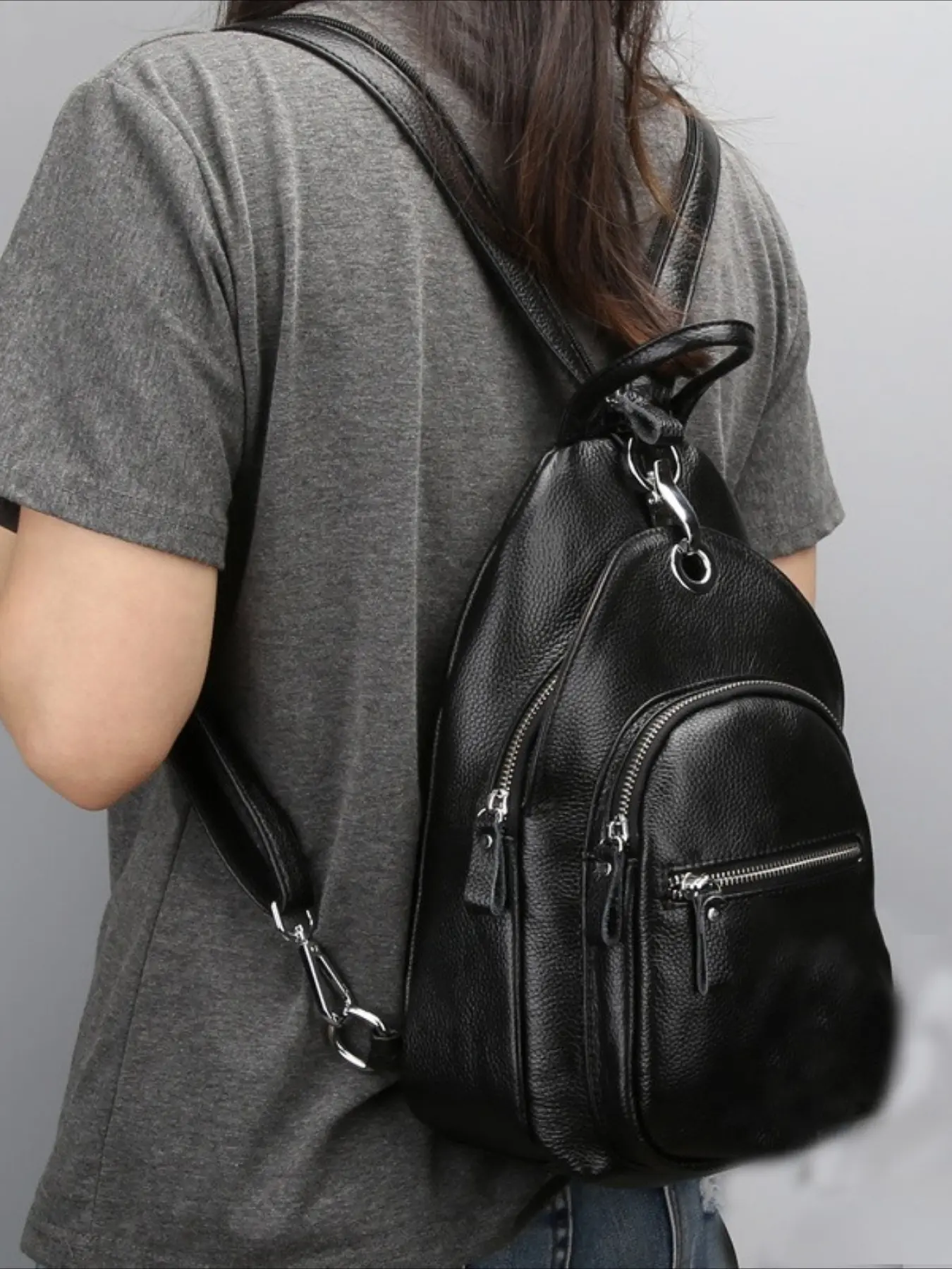 Small leather backpack, first-layer cowhide breast bag, fashionable and versatile women's backpack, multi-layer anti-theft casual women's bag.