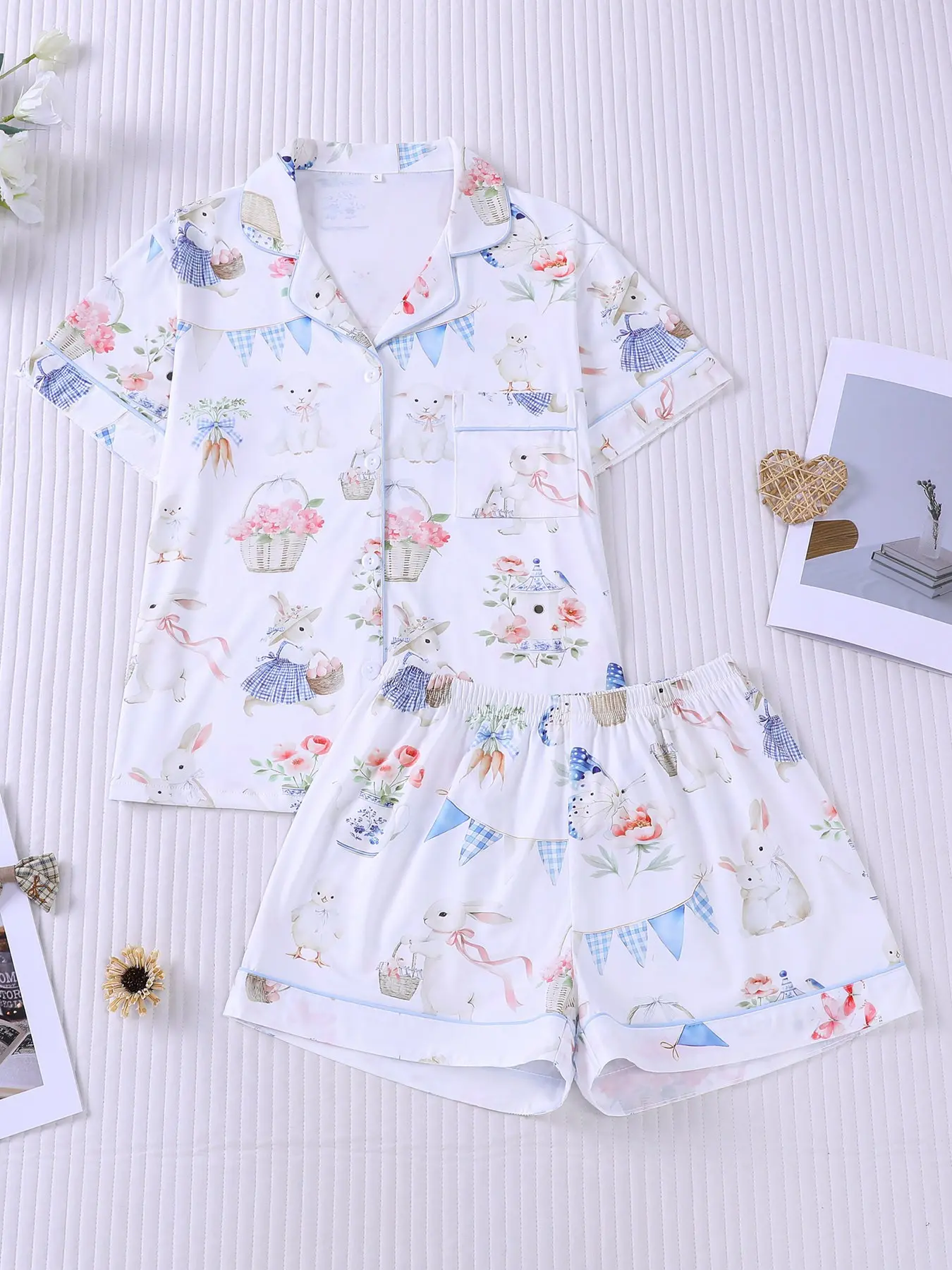 Women's 2-piece pajama set pjs with watercolor bunnies, chicks, flowers, carrots and plaid bunting prints, cute pastoral style with light blue piping. Lapel top with pocket, elastic waist shorts, soft fabric for all-season daily home loungewear nightwear