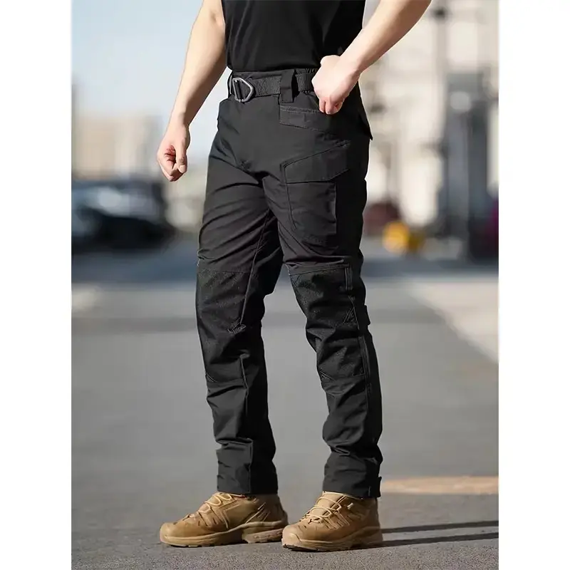 Men's Solid Color Zippered Waterproof Tactical Work Pants feature a wide stretch waistband and a tailored waterproof tactical design. Ideal for spring and summer wear, these are durable pants specially designed for men engaged in outdoor training