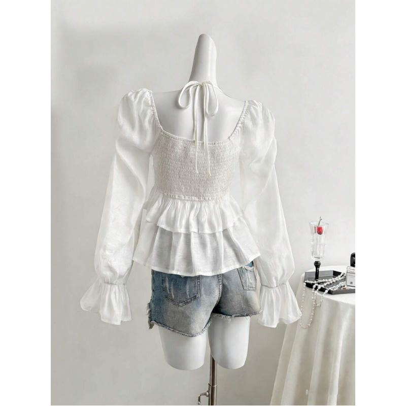 Elegant French-style sheer fabric blouse with ribbon ties and ruffled long sleeves for women, featuring ruffles, asymmetrical design, knotted detail, solid color, bell sleeves, suitable for spring, summer, and autumn