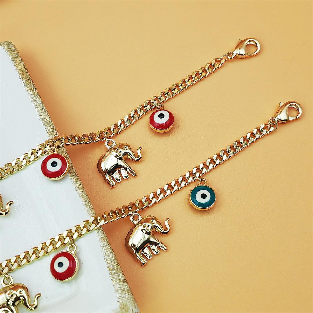 Gold Devil's Eye Bracelet with Baby Elephant Pendant Adjustable Length for Stylish Accessory SpringStatements