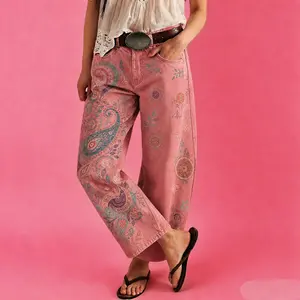 Women's vintage-wash wide-leg jeans; Y2K-style loose-fitting trousers; soft pink base with a bohemian floral print; suitable for year-round outdoor activities and streetwear styling.
