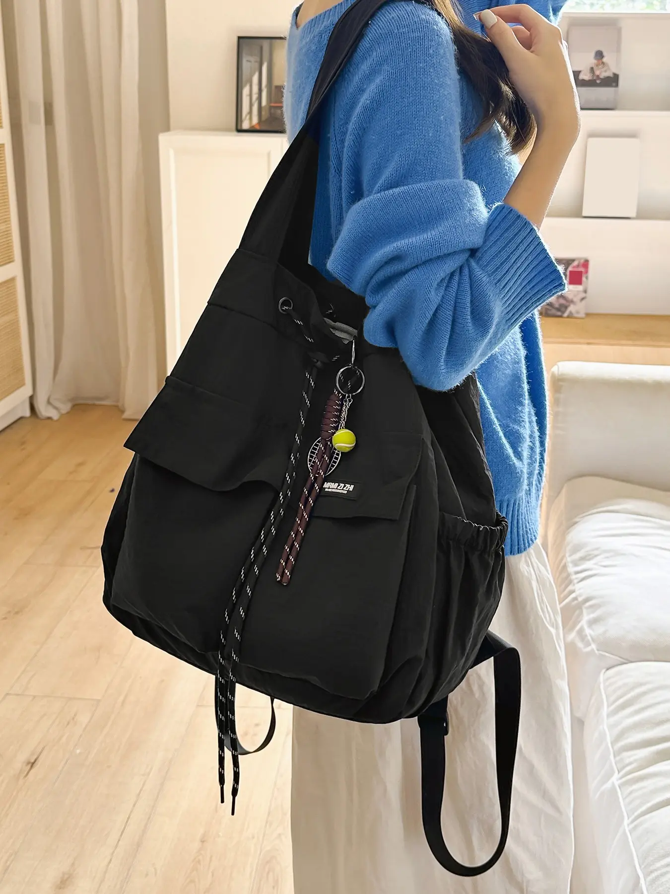 Ladies' backpack, simple large capacity shoulder bag, niche design durable crossbody bag, with exquisite pendant, suitable for travel, commuting, school and outdoor activities, multi pocket design, commuting for office workers, daily outings