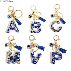Royal Blue Alphabet Pendant In A-Z Options Designed With Flowy Tassel And Fabric Decor, Lucky Evil Eye Charm Adds Bohemian Vibe, Lightweight Portable Bag Accessory Perfect For Daily Backpack Carry And Handbag Fashion Styling