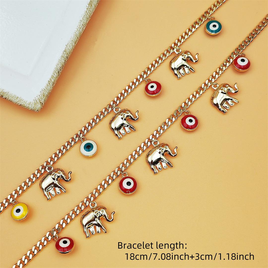 Gold Devil's Eye Bracelet with Baby Elephant Pendant Adjustable Length for Stylish Accessory SpringStatements