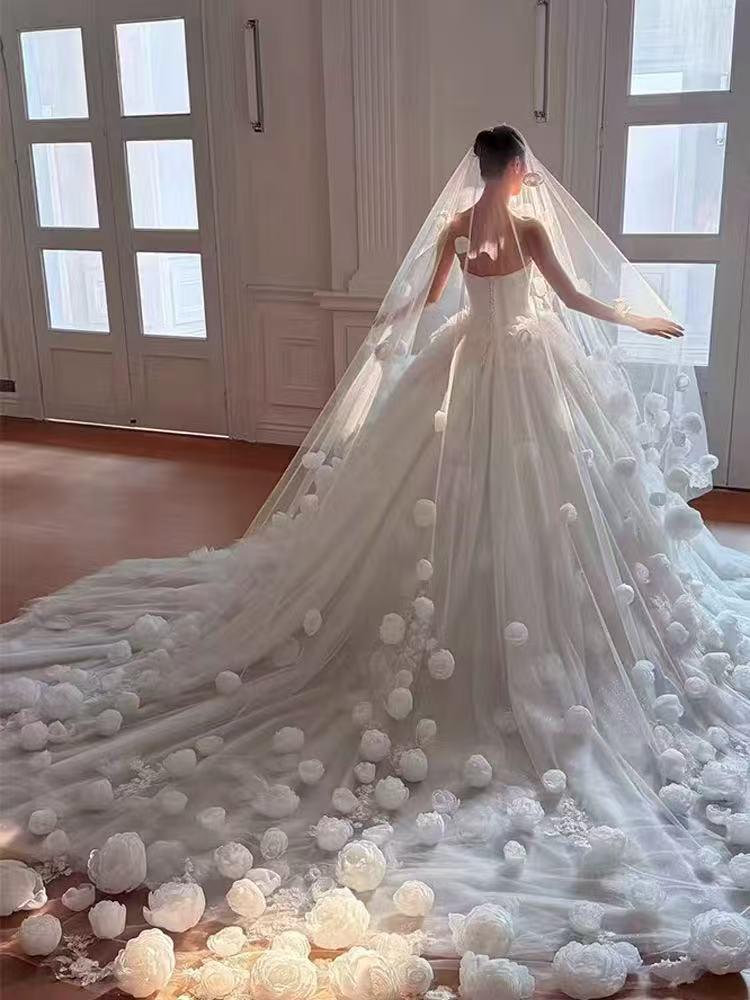 Luxury-style long veil with dreamy, elaborate floral designs and a cathedral-style train