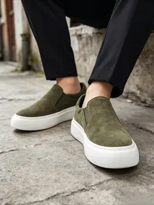 Military green platform slip-on loafers, perfect for lazy people as they don't require lacing, look casual and elegant when worn, have a platform for hidden height increase, and look super stylish when paired with dress pants.