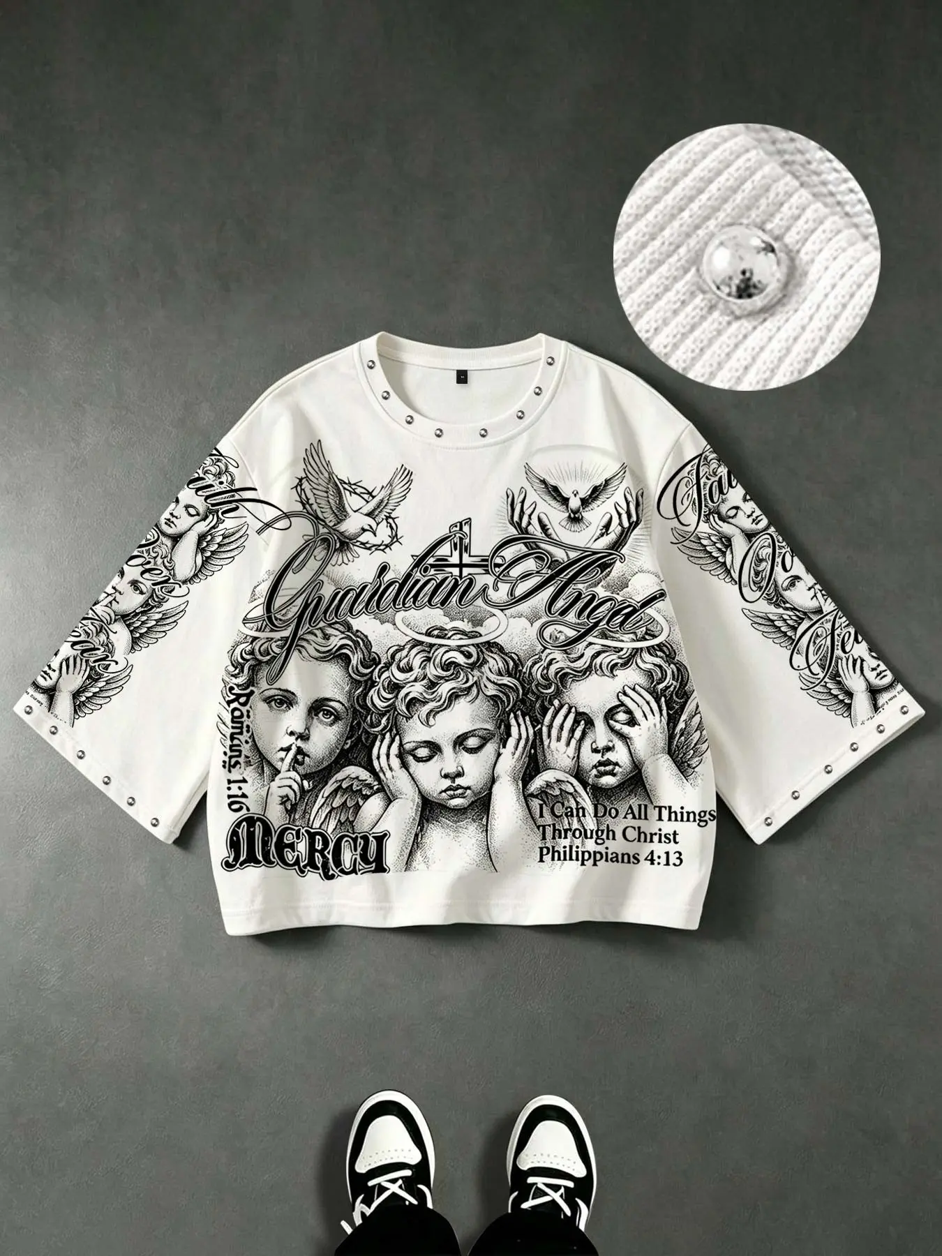 "See No Evil, Hear No Evil, Speak No Evil" angel-print men's 3/4-sleeve T-shirt; unisex cropped T-shirt with stud embellishments and "MERCY" script lettering/dove graphic—a loose-fitting, streetwear-style, hip-hop inspired 3/4-sleeve tee.