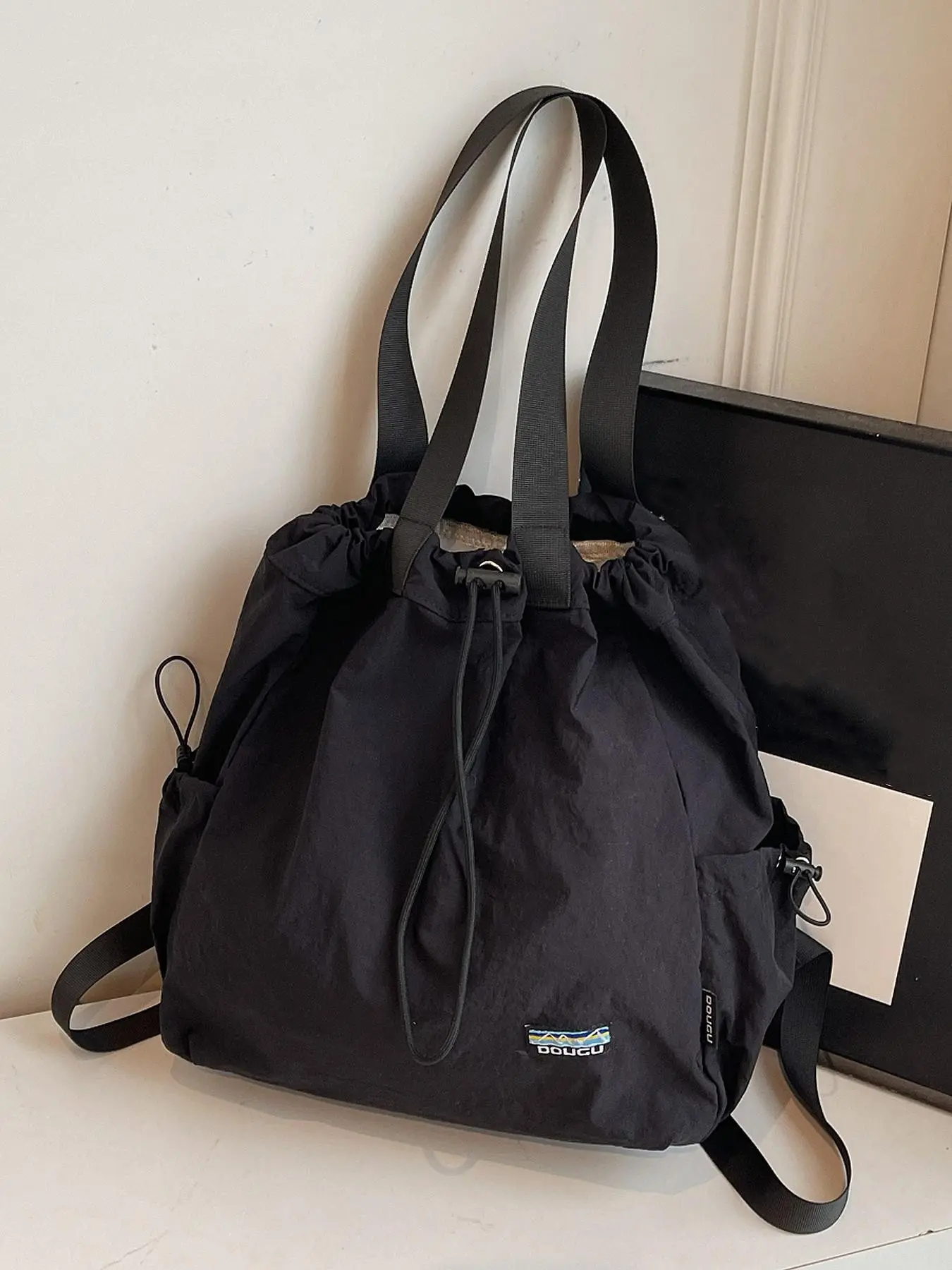 Simple casual style practical texture retro tote bag, drawstring and side pocket design, large capacity fashionable multi back personalized single shoulder handbag, suitable for daily commuting, shopping in the mall, Commuter Bags