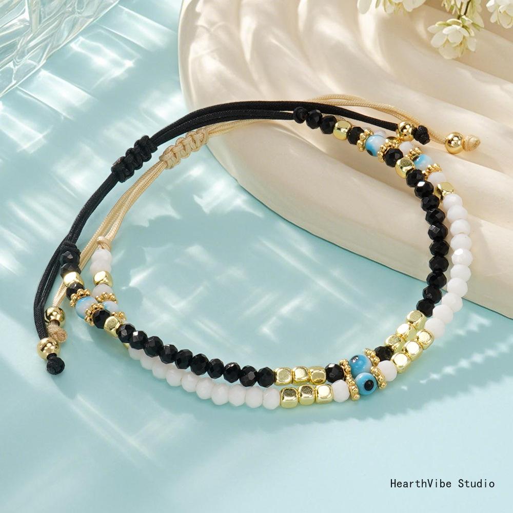 "Eye of the Demon" Couples' Bracelets: Black & White Crystal Beaded Set (2 Pieces) — Versatile, Hand-Woven Wristbands