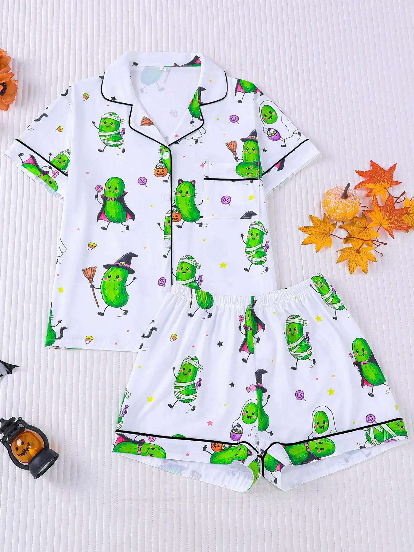 Women's 2-piece Halloween pajama set, white base with funny cartoon pickle prints in mummy, witch and vampire costumes, plus pumpkins & candies. Green piping lapel top with pocket, elastic waist shorts, soft all-season women festive loungewear