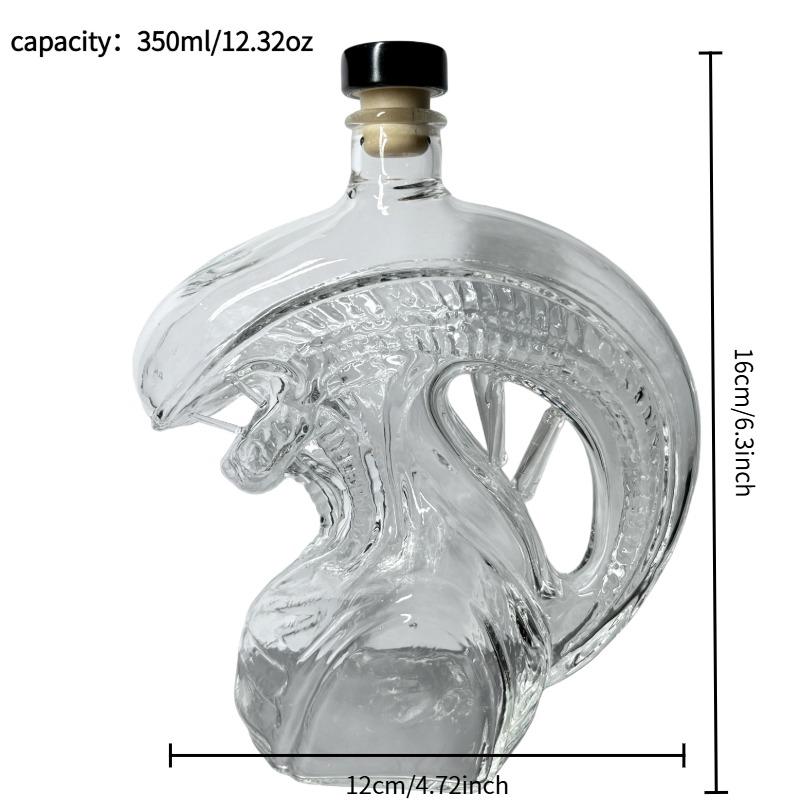 The Monster Decanter—an alien-themed glass decanter inspired by classic movie monsters. An exceptional collectible, it seamlessly combines the practical function of holding spirits with the decorative aesthetic of a creative display piece. (Glass)