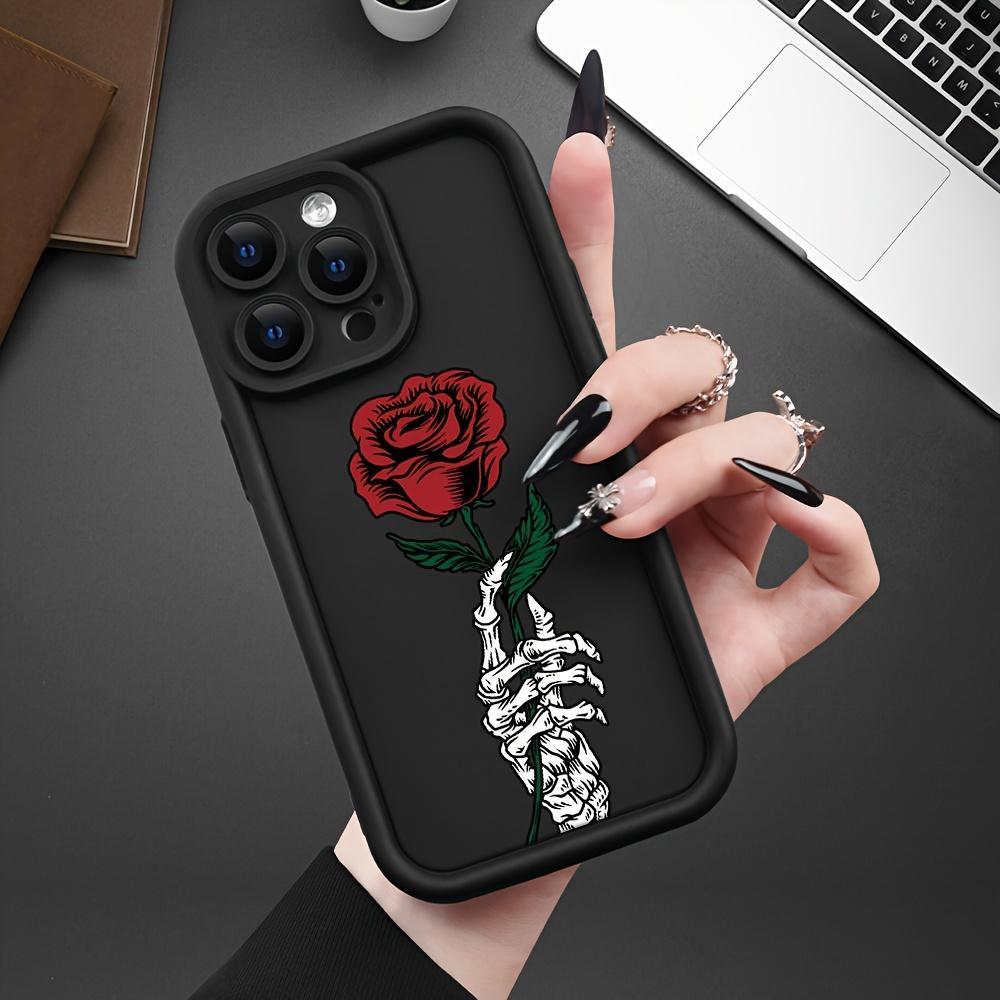 Black Phone Cover Designed for Iphone Models 16 Pro Max, 15 Plus, 14, 13, 12, 11, XR, And XS Featuring a Skull And Rose Design, Made from Anti-Scratch And Shockproof TPU Material for Drop Protection.
