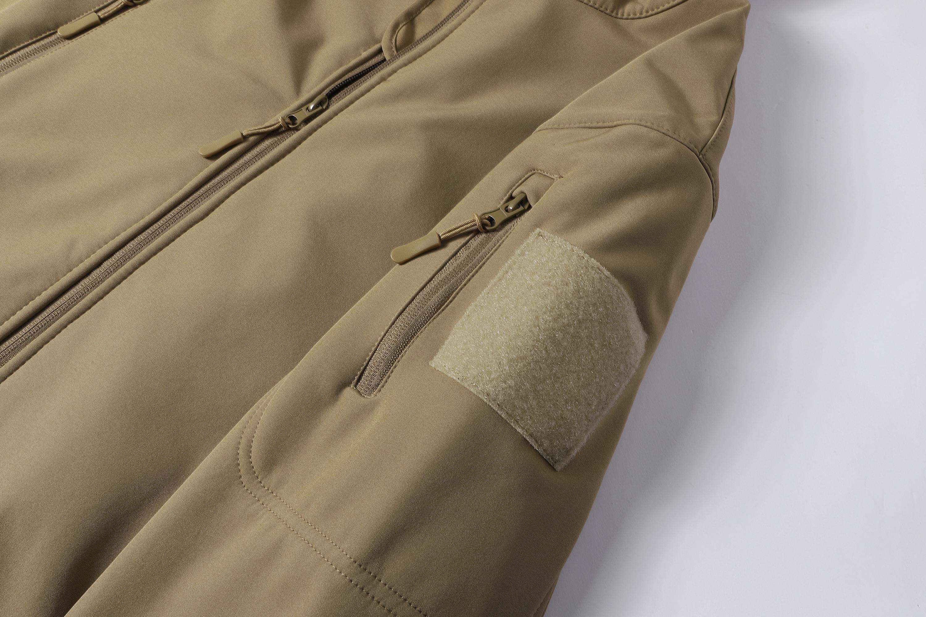 A men's hooded jacket with an outdoor and functional style features multiple zipper pockets distributed on the chest, arms, etc., making it convenient to store various small items and highly practical. Hood with drawstring closure