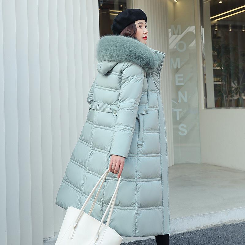 New winter women's thickened long over-the-knee hooded cotton-padded coat with large fur collar.