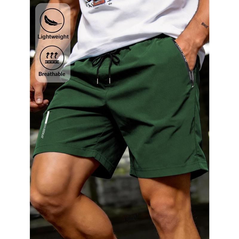 Men's Sports Shorts, Breathable Quick Drying Fabric, Zipper Pocket and Drawstring Elastic Waistband, Reflective Stripe Print, Solid Color Sports Style, Suitable for Running, Fitness, Outdoor Leisure Sports, Mid Waist Regular Version