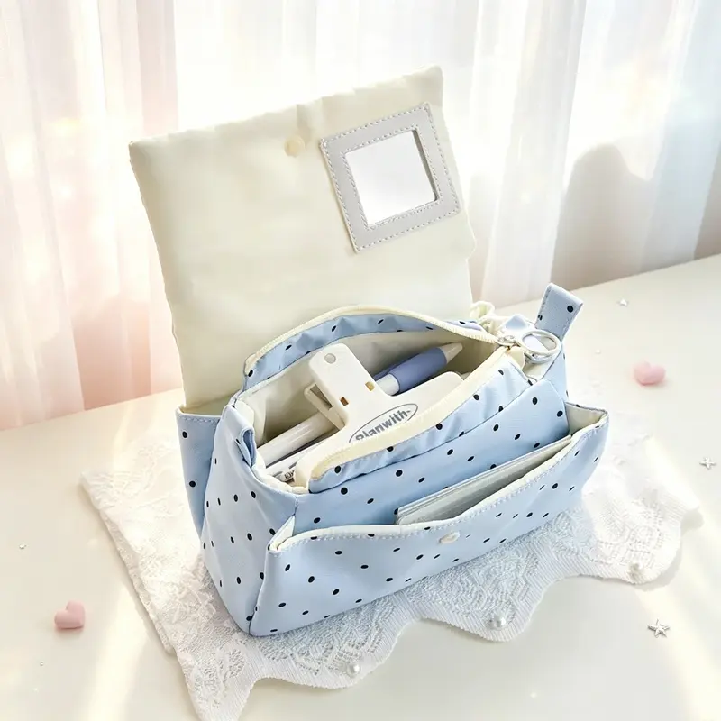 A sky blue butterfly polka dot flip-top pencil case, featuring a blue and white color contrast, is convenient for storage and carrying, suitable for children, students, and office organization, and can be DIY modified into a makeup bag or handbag.