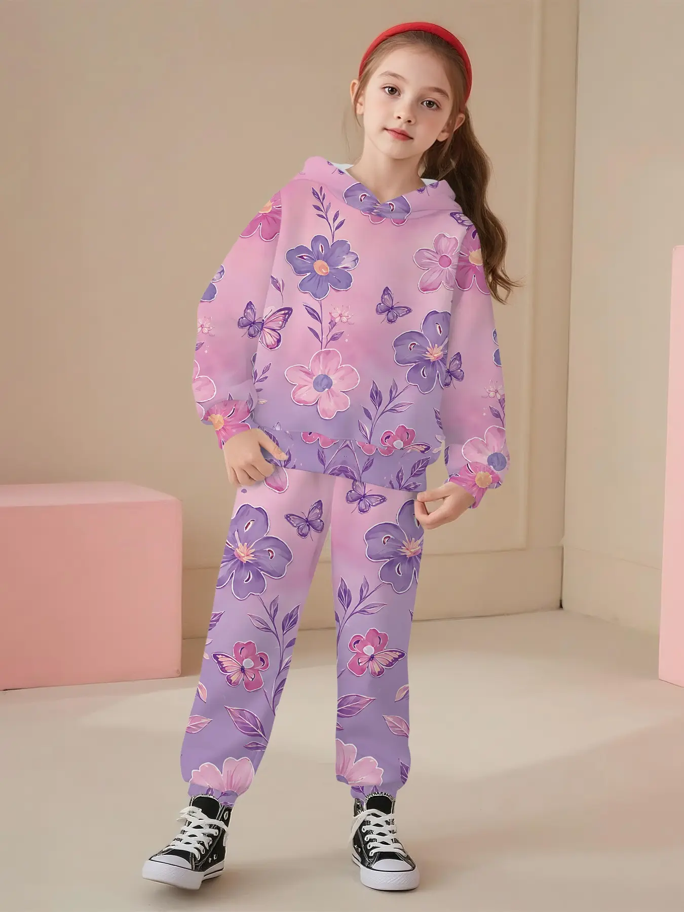 Two-piece set consisting of a girls' hooded sweatshirt and long pants. This sweet and gentle kids' outfit features an all-over fresh print with large flowers, butterflies and branches in a gradient pink-purple shade. Adopting digital printing technology,