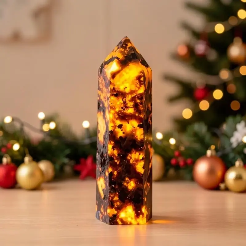 This is a flame stone that exhibits dazzling orange yellow fluorescence under ultraviolet (UV) light irradiation. It is a flame stone tower, marble patterned hexagonal prism, and a must-have gift for festivals