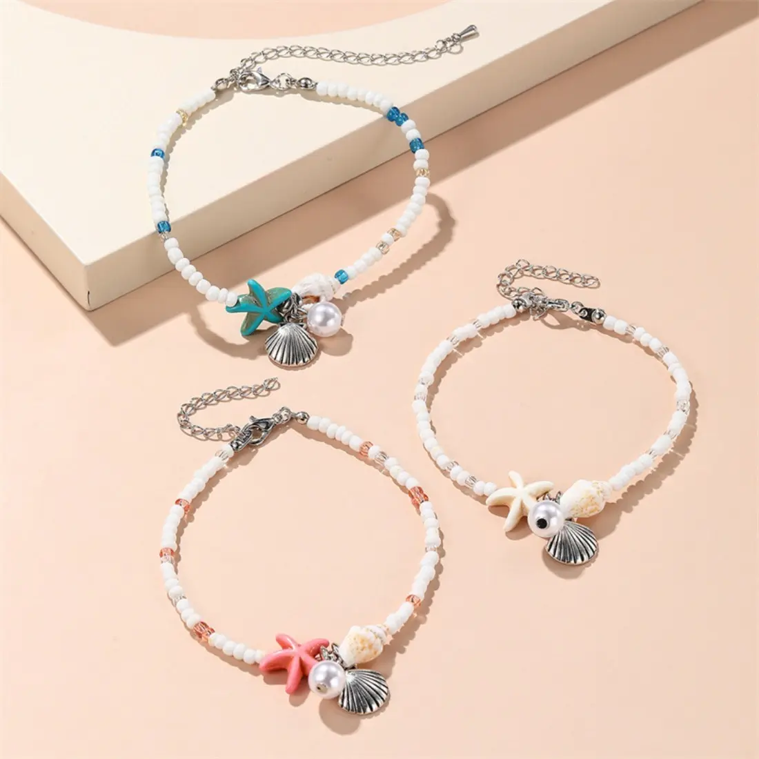 Ocean Inspired Rice Bead Bracelet for Women, Starfish Shell Conch Charm Beaded Jewelry, Coastal Boho Aesthetic Stackable Bracelet, Lightweight Natural Style Accessory for Beach Vacation Summer Daily Wear Gift