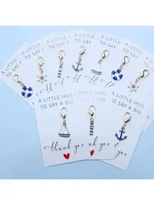 A 10-piece nautical keychain set, suitable as a souvenir for summer beach parties, featuring a sailboat, anchor, lighthouse, life buoy and rudder.