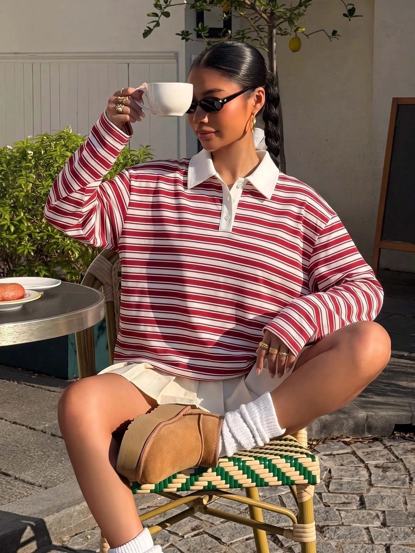 Women's red and white striped long-sleeve polo shirt, soft and comfortable vintage collegiate-style top, minimalist everyday aesthetic, perfect for brunch dates, campus outings, city strolls, coffee to-go, and weekend trips.
